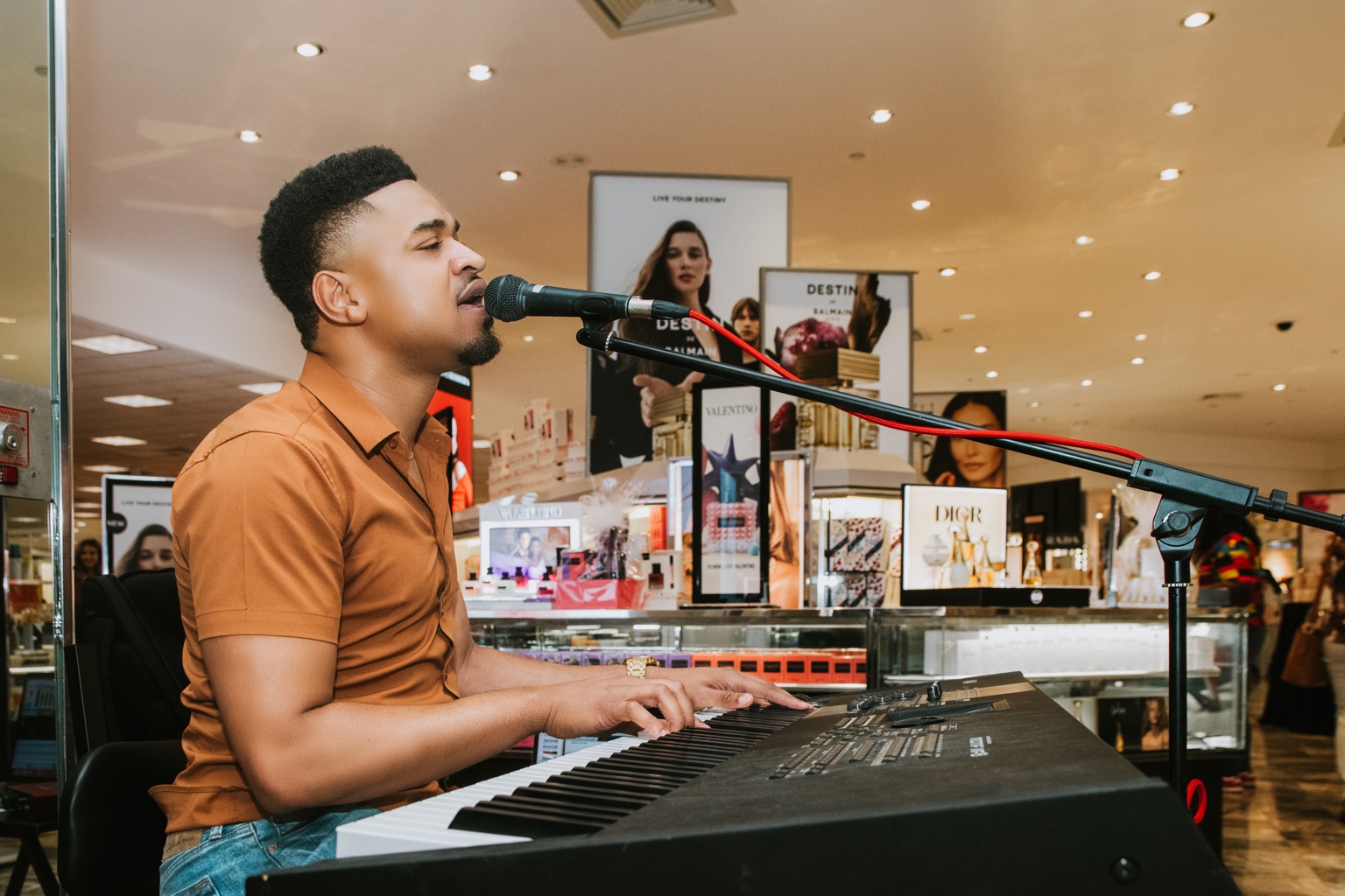 Steve Luv performing at piano